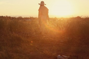 The Bone Gatherer (photo of woman in field)